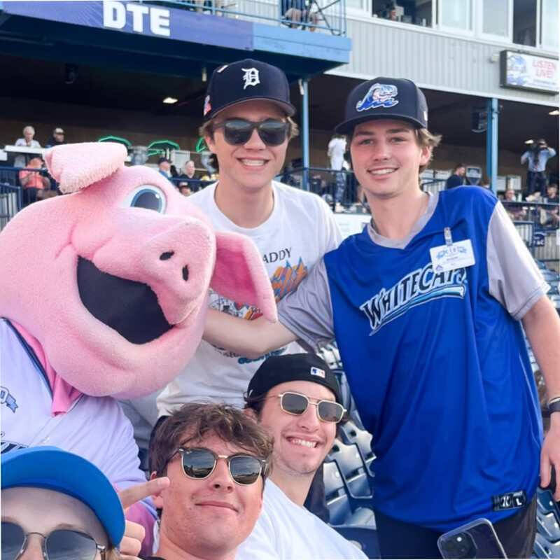 Bo posing with a pig